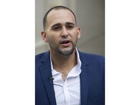 Iraq war veteran Jose Belen, who takes marijuana to treat post-traumatic stress disorder, poses in front of federal court, Tuesday, Feb. 13, 2018, in New York. Belen is one of five plaintiffs in a lawsuit challenging federal marijuana laws. He is set to appear in a New York courtroom on Wednesday for arguments in a lawsuit that claims classifying marijuana as a dangerous drug is irrational and unconstitutional.