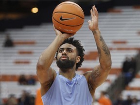 North Carolina's Joel Berry II shoots before an NCAA college basketball game against Syracuse in Syracuse, N.Y., Wednesday, Feb. 21, 2018.