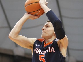 Virginia's Kyle Guy shoots in the first half an NCAA college basketball game against Syracuse in Syracuse, N.Y., Saturday, Feb. 3, 2018.