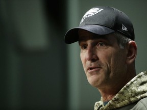 FILE - This Dec. 12, 2017 file photo shows  Philadelphia Eagles offensive coordinator Frank Reich speaking with members of the media during a news conference at the team's NFL football training facility in Philadelphia. A person with direct knowledge of the deal tells The Associated Press that Reich has agreed to become the Indianapolis Colts' new coach. The person spoke Sunday, Feb. 11, 2018 on condition of anonymity because no official had yet been made. An introductory news conference has not yet been scheduled.