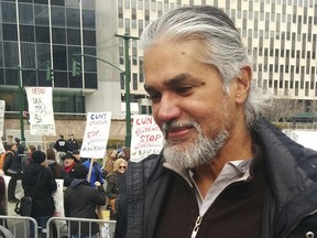 Immigration activist Ravi Ragbir appears at a rally given in his honor Saturday, Feb. 10, 2018 in New York. Ragbir, who is from Trinidad and Tobago, faced deportation on Saturday until a judge ruled Friday that he could stay in the country while a lawsuit filed on his behalf is argued.