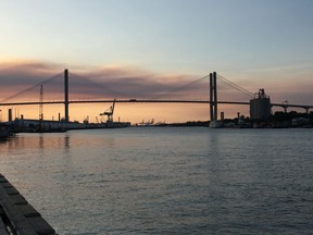 FILE - This April 20, 2017, file photo shows the Eugene Talmadge Memorial Bridge at sunset in Savannah, Ga. Hundreds of Girl Scouts are expected to gather in the Georgia Capitol, Tuesday, Feb. 6, 2018, offering milk and cookies as they try to persuade lawmakers to get their founder's name affixed to the bridge that's currently named after a white segregationist.