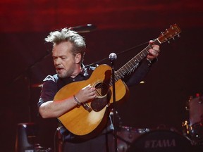 FILE - In this Thursday, April 6, 2017, file photo, John Mellencamp performs at a concert at Bridgestone Arena in Nashville, Tenn. The 2018 Songwriters Hall of Fame class will include Mellencamp, Alan Jackson, Kool & the Gang and Jermaine Dupri, who will become the second hip-hop act inducted into the prestigious organization.