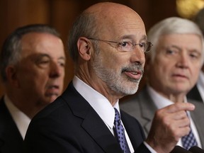 FILE - In this Oct. 7, 2015, file photo, Pennsylvania Gov. Tom Wolf, center, accompanied by state House Minority Leader Rep. Frank Dermody, right, D-Allegheny, and state Rep. Joe Markosek, left, D-Allegheny, discuss state budget negotiations at the state Capitol in Harrisburg, Pa. Pennsylvania's high court issued a new congressional district map for the state's 2018 elections on its self-imposed deadline Monday, Feb. 19, 2018, all but ensuring that Democratic prospects will improve in several seats and that Republican lawmakers challenge it in federal court. The map of Pennsylvania's 18 congressional districts is to be in effect for the May 15 primary and substantially overhauls a congressional map widely viewed as among the nation's most gerrymandered. The map was approved in a 4-3 decision.