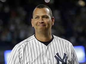 FILE - In this Aug. 12, 2016, file photo, New York Yankees' Alex Rodriguez smiles during a ceremony prior to his final baseball game with the team, against the Tampa Bay Rays in New York. New York said Sunday, Feb. 25, 2018, that Rodriguez is remaining with the New York Yankees as a special adviser.