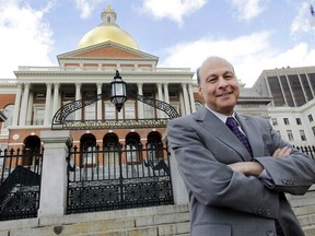 FILE - In this April 2, 2012, file photo, Massachusetts state Sen. Stan Rosenberg, D-Amherst, poses outside the Statehouse in Boston. The Boston Globe reported Sunday, Feb. 4, 2018 that Rosenberg's husband, Bryon Hefner, had involved himself in matters before the Senate and had access to Rosenberg's Senate email despite Rosenberg's promise to keep a "firewall" between his professional and personal lives. Massachusetts Gov. Charlie Baker says if there's truth to new reports involving Rosenberg then he shouldn't return to the Senate's top post.