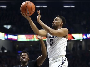 Xavier Trevon Bluiett drives to the basket during the first half of an NCAA college basketball game against Providence, Wednesday, Feb. 28, 2018, in Cincinnati.