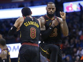 Cleveland Cavaliers forward LeBron James (23) celebrates with teammate Jordan Clarkson during the second half of the team's NBA basketball game against the Oklahoma City Thunder in Oklahoma City, Tuesday, Feb. 13, 2018.