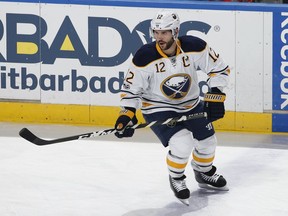 FILE - In this April 8, 2017, file photo, Buffalo Sabres right wing Brian Gionta (12) skates prior to an NHL hockey game against the Florida Panthers, in Sunrise, Fla. As the longtime NHL veterans try to win a medal for the United States at the Olympics, their agents are talking to teams about getting them signed once the tournament is over. Gionta and James Wisniewski will have about a day and a half to sign between the end of the Olympics and the deadline to be eligible for the playoffs and are ready to jump back in.