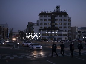 FILE - In this Feb. 3, 2018 photo, illuminated Olympic rings shine at dusk prior to the 2018 Winter Olympics in Gangneung, South Korea. As South Korea basks in the glow of daily competition and global attention, hope is fading that Pyeonchgang will do what was promised during its successful 2011 Olympics bid and turn an ignored, impoverished backwater into a premier Asian ski hub.