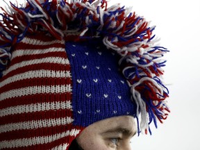 A United States fan watches the men's 12.5-kilometer biathlon pursuit at the 2018 Winter Olympics in Pyeongchang, South Korea, Monday, Feb. 12, 2018.