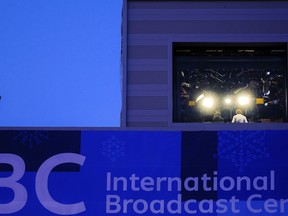 Television personnel work inside of the International Broadcast Center at the 2018 Winter Olympics in Pyeongchang, South Korea, Wednesday, Feb. 21, 2018. Live television has always presented challenges, but NBC's Olympic stumbles this month have unfolded before an audience ready to pounce.