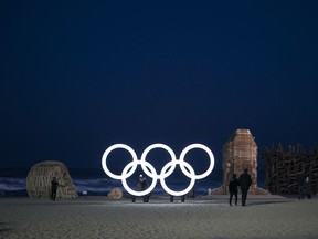 Olympic rings glow next to art installations prior to the 2018 Winter Olympics in Gangneung, South Korea, Sunday, Feb. 4, 2018. Gangneung is the site of the coastal cluster which will host ice hockey, figure skating, speed skating, short track and curling for the 2018 Olympics.