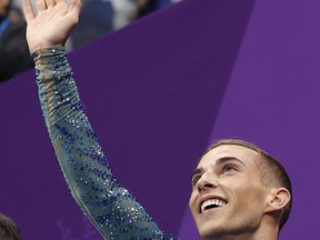 Adam Rippon of the United States reacts as his score is posted following his performance in the men's free figure skating final in the Gangneung Ice Arena at the 2018 Winter Olympics in Gangneung, South Korea, Saturday, Feb. 17, 2018.