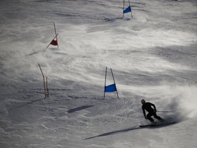 An athlete trains at the Yongpyong Alpine Center at the 2018 Winter Olympics in Pyeongchang, South Korea, Friday, Feb. 16, 2018.
