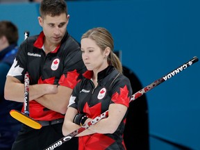 Canada's John Morris and Kaitlyn Lawes during their game against Norway in mixed doubles curling at the Winter Olympics.