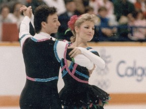 In this 1988 file photo, Rob McCall and Tracy Wilson skate at the Calgary Olympics.