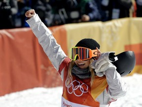 Chloe Kim, of the United States, reacts to her run during the women's halfpipe finals at Phoenix Snow Park at the 2018 Winter Olympics in Pyeongchang, South Korea, Tuesday, Feb. 13, 2018.