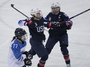Gigi Marvin (19), of the United States, celebrates with Meghan Duggan (10) after scoring a goal against Finland during the first period of the semifinal round of the women's hockey game at the 2018 Winter Olympics in Gangneung, South Korea, Monday, Feb. 19, 2018.