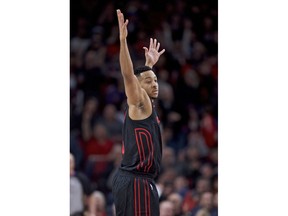 Portland Trail Blazers guard CJ McCollum reacts after making a three-point basket during the first half of an NBA basketball game against the Chicago Bulls in Portland, Ore., Wednesday, Jan. 31, 2018.