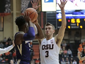 Oregon State's Tres Tinkle (3) pressures Washington's Jaylen Nowell (5) during the first half of an NCAA college basketball game in Corvallis, Ore., Saturday, Feb. 10, 2018.