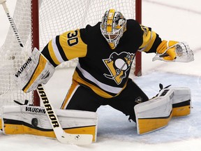 Pittsburgh Penguins goaltender Matt Murray blocks a shot during the first period of the team's NHL hockey game against the Ottawa Senators in Pittsburgh, Tuesday, Feb. 13, 2018.
