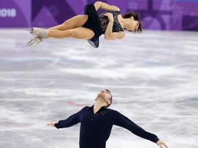 Canada's Meagan Duhamel and Eric Radford during pairs short program team event.