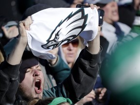 A Philadelphia Eagles fan chants while waiting for the team to arrive at Philadelphia International Airport a day after defeating the New England Patriots in Super Bowl 52 in Minneapolis, Monday, Feb. 5, 2018.