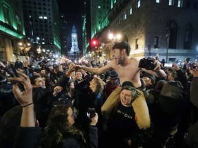 Philadelphia Eagles fans celebrate the team's victory in the NFL Super Bowl 52 between the Philadelphia Eagles and the New England Patriots, Sunday, Feb. 4, 2018, in downtown Philadelphia.