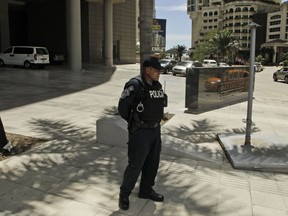 A police officer stands outside the Trump Ocean Club International Hotel and Tower in Panama City, Tuesday, Feb. 27, 2018.