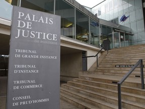The entrance of the hall of justice is pictured Tuesday, Feb.13, 2018 in Pontoise, outside Paris. A 29-year-old man is set to appear in a French court Tuesday for having sex with an 11-year-old girl last year, in a trial that has rekindled debate on the age of sexual consent in France. In a decision that shocked many, the prosecutor's office in the Paris suburb of Pontoise decided to send the man to trial on charges of "sexual abuse of a minor under 15 years old," and not rape.
