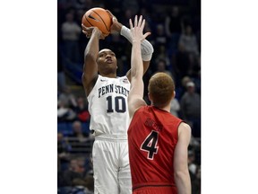 Penn State's Tony Carr shoots over Maryland's Kevin Hurter during an NCAA college basketball game Wednesday, Feb. 7, 2018, in State College, Pa.