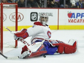 Montreal Canadiens' Carey Price stops a shot by Philadelphia Flyers' Claude Giroux, not pictured, in the second period of an NHL hockey game Tuesday, Feb. 20, 2018 in Philadelphia.