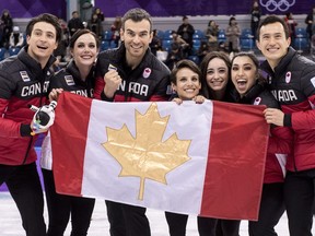 Canada's Scott Moir, left to right, Tessa Virtue, Eric Radford, Meagan Duhamel, Kaetlyn Osmond, Gabrielle Daleman, and Patrick Chan celebrate their gold medal victory in the team figure skating event at the Pyeonchang Winter Olympics Monday, February 12, 2018 in Gangneung, South Korea.