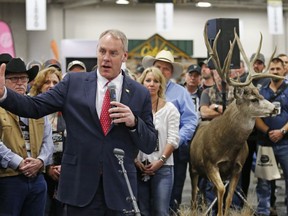 FILE--In this Feb. 9, 2018, file photo,U.S. Interior Secretary Ryan Zinke speaks during an conservation announcement at the Western Conservation and Hunting Expo Friday in Salt Lake City. On Monday, Feb. 12, 2018, the Interior Department released budget documents showing Zinke plans to press ahead with a massive overhaul of his department, including a plan to relocate some officials from Washington to the West and creating a new organizational map that mostly ignores state boundaries.
