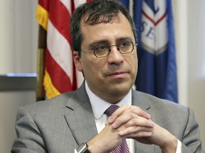 FILE- This Dec. 13, 2017, file photo shows L. Francis Cissna, director of U.S. Citizenship and Immigration Services, during an interview in his office in downtown Los Angeles. Cissna told The Associated Press on Friday, Feb. 23, 2018, that he cut a reference to the U.S. being a "nation of immigrants" from Citizenship and Immigration Services' mission statement because he felt it didn't belong on what he called a bureaucratic document.