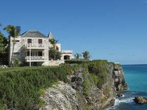 The original Crane Hotel sits at the edge of a cliff overlooking the Atlantic Ocean in Barbados.