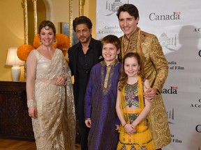 Prime Minister Justin Trudeau and his family pose for a photograph with Bollywood actor Shahrukh Khan in Mumbai on February 20, 2018.