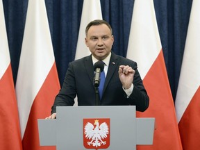 Polish President Andrzej Duda announces his decision to sign a legislation penalizing certain statements about the Holocaust, in Warsaw, Poland, Tuesday, Feb. 6, 2018. Duda said that he will also ask the constitutional court to make final ruling on the disputed Holocaust speech bill.