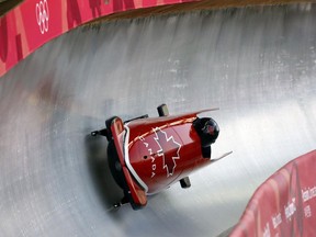 Chris Spring and Neville Wright of Canada take a curve during the two-man bobsled training on Friday, Feb. 16, 2018.