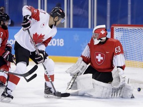 Rene Bourque of Canada scores a goal on Switzerland at the Pyeongchang Olympics on Feb. 15.