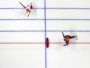 Jorien ter Mors of The Netherlands, right, pushes her skate over the finish line as she competes against Kaja Ziomek of Poland during the women's 500 meters speed skating race at the Gangneung Oval at the 2018 Winter Olympics in Gangneung, South Korea, Sunday, Feb. 18, 2018.