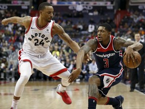 Toronto Raptors forward Norman Powell guards the Wizards' Bradley Beal during the second half of their game Thursday night in Washington. The Wizards won 122-119.