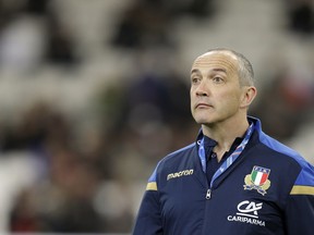 Italy's rugby coach Conor O'Shea watches his players during the warm up prior to the start of the Six Nations rugby union match between France and Italy at the Velodrome stadium in Marseille, southern France, Saturday, Feb. 23, 2018.