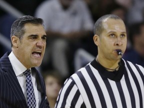 Villanova coach Jay Wright has words with a referee during the first half of the team's NCAA college basketball game against Providence on Wednesday, Feb. 14, 2018, in Providence, R.I.