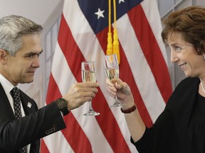 U.S. Ambassador to Mexico Roberta Jacobson, right, toasts with Mexico City Mayor Miguel Angel Mancera during the groundbreaking ceremony for the new U.S. embassy, slated to cost nearly $1 billion, in Mexico City, Tuesday, Feb. 13, 2018. Work has begun on the long-awaited new embassy in Mexico City which is being built on a former industrial site that required extensive toxic cleanup and will be one of the most expensive U.S. embassies in the world.