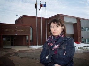 School principal Chantal Desroches poses in front of her school Ecole Calixte-F.-Savoie in Sainte-Anne-de-Kent, N.B., on Tuesday, Feb. 6, 2018.