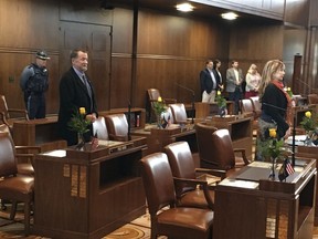 Oregon state Sen. Jeff Kruse's desk, center left, is empty as senators attend Legislative opening ceremonies at the Capitol on Wednesday, Feb. 7, 2018, a day after a report accused him of harassment and the governor and house speaker called for him to resign. Kruse didn't appear as Wednesday's session commenced and he was not in his capitol office.
