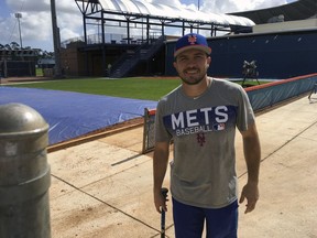 New York Mets baseball catcher Travis d'Arnaud poses for a photo in Port St. Lucie, Fla., Monday, Feb. 12, 2018. While the New York Mets focused on adding power and pitching this offseason, one problem area they didn't address was catcher. They're still counting on once-touted prospects Travis d'Arnaud and Kevin Plawecki _ or at least one of them _ to finally step forward and solidify that spot.