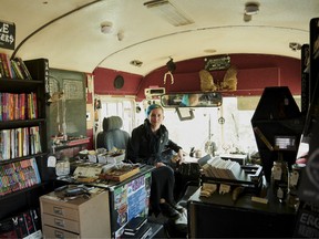Emily Black, who lives with her partner Sade Black in this "skoolie" (a converted school bus) dubbed Road Virus, which serves as both living quarters and mobile bookstore, at the Rubber Tramp Rendezvous in Quartzite, Ariz., Jan. 17, 2018. A disparate tribe of vehicular nomads flock to this dusty desert town each winter.